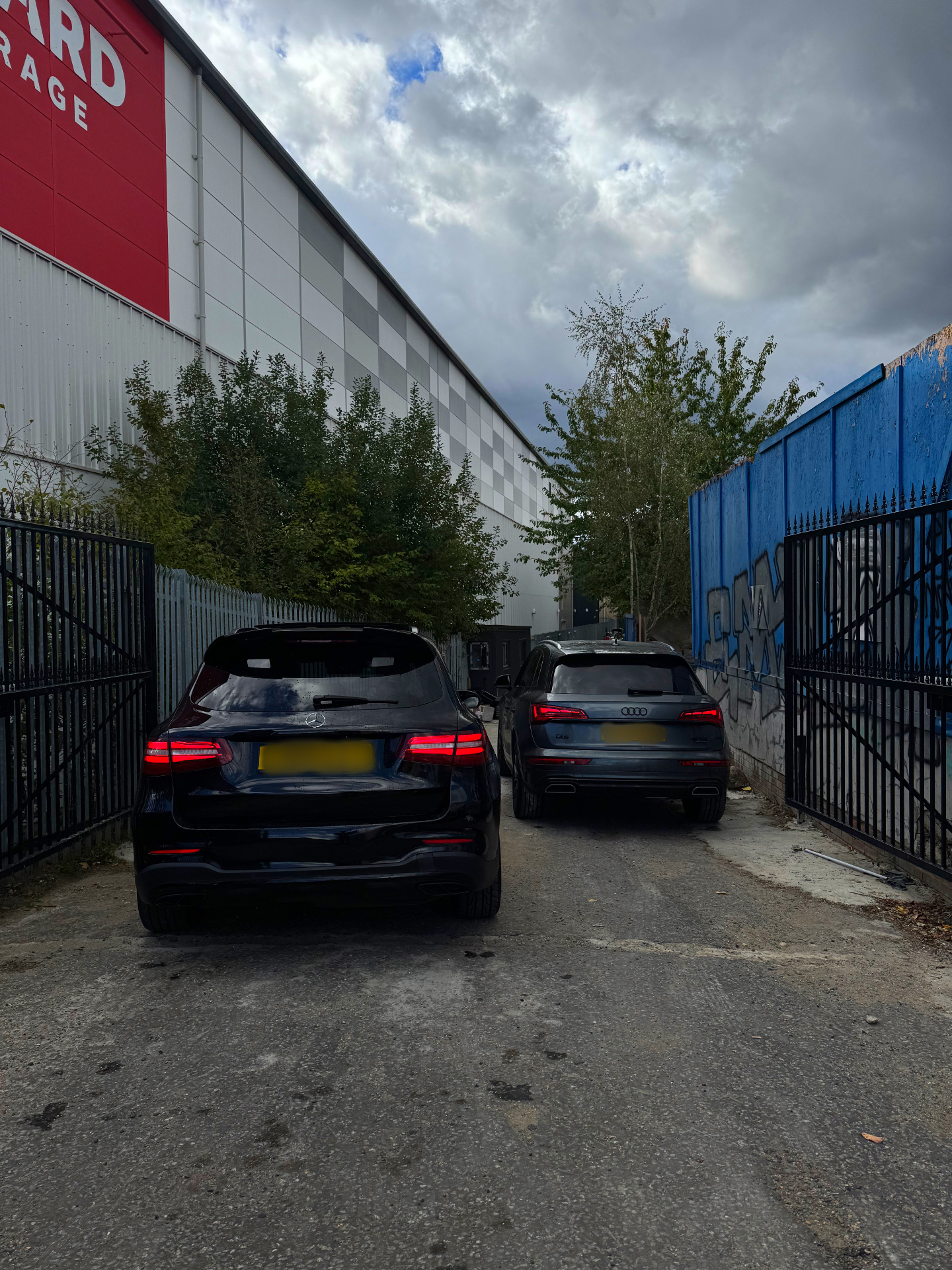 Rear view of two Bridgegate hire vehicles